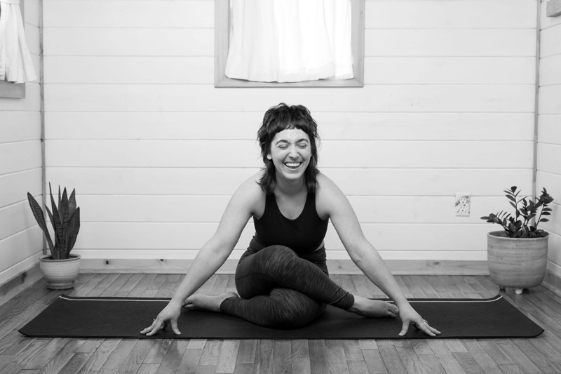 Yin yoga instructor laughing in studio